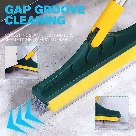 Cleaning tool with green and yellow handle cleaning gaps and seams on a surface.