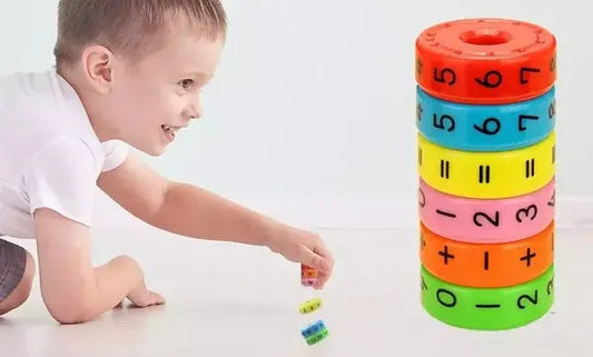 Child playing with a colorful stacking toy on a white background