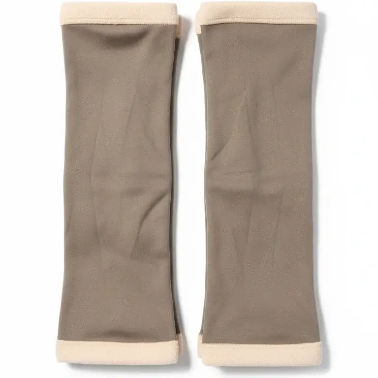 Pair of beige arm sleeves on a white background