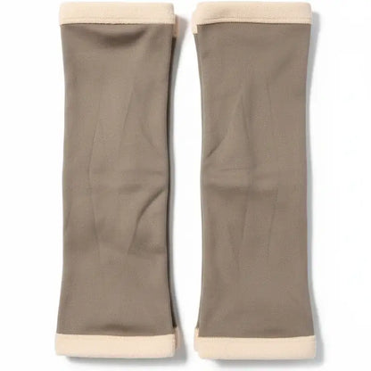 Pair of beige arm sleeves on a white background