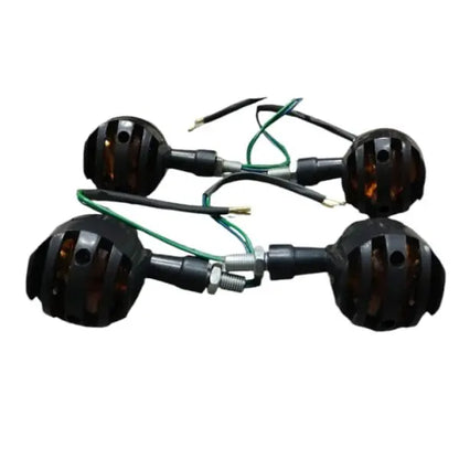 Set of motorcycle turn signals with wiring on a white background