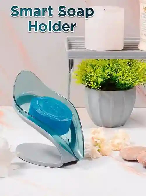 Smart soap holder with blue soap on a white surface with a plant in the background