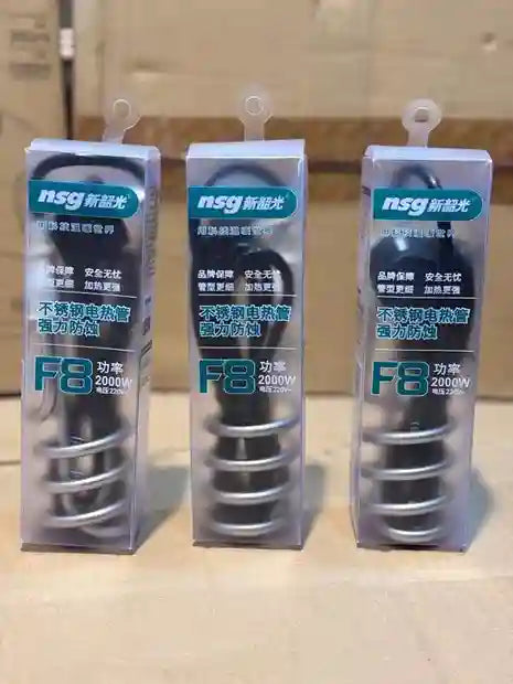 Three NSG brand light bulb packages on a reflective surface