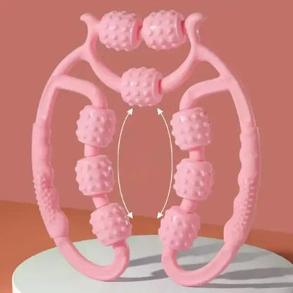 Pink neck massager on a light blue stand with a pink background