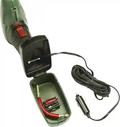Green electric tool with cable and car adapter on a white background