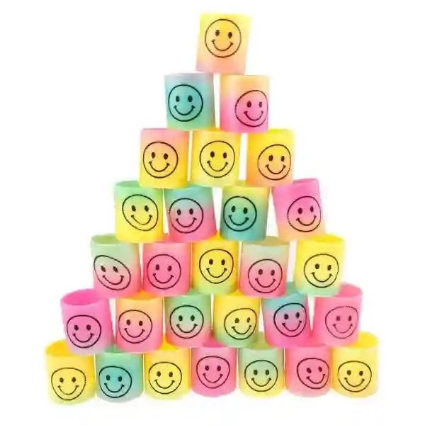 Stack of colorful blocks with smiley face designs on a white background