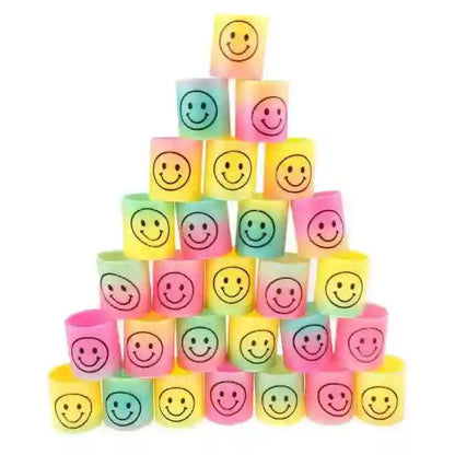 Stack of colorful blocks with smiley face designs on a white background