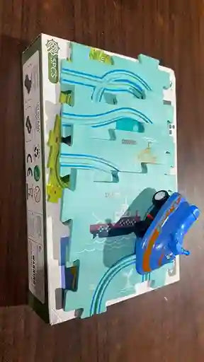 Toy car and track set packaging on a wooden surface