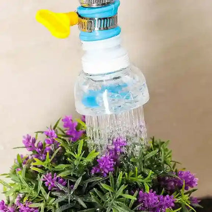 Garden hose nozzle watering purple flowers against a beige background