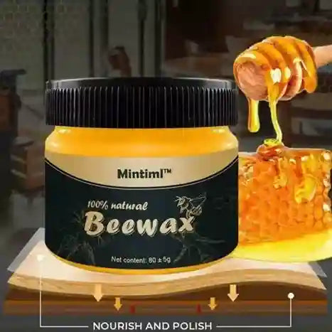 Jar of Mintiml beewax with a hand applying it to wood.