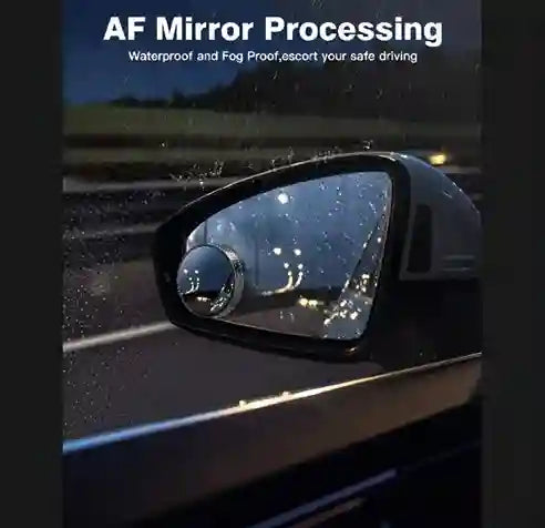 Car side mirror with waterproof and fog-proof coating on a road at night.