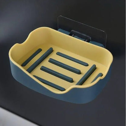 Yellow and green soap dish on a dark background