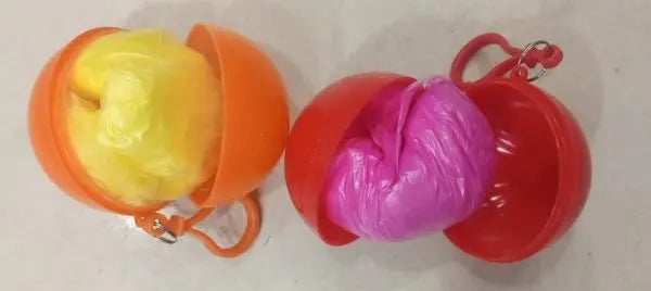 Two colorful plastic toys, one yellow and orange, the other pink and red, on a white background.