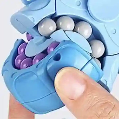 Blue fidget spinner with beads being twisted by a hand