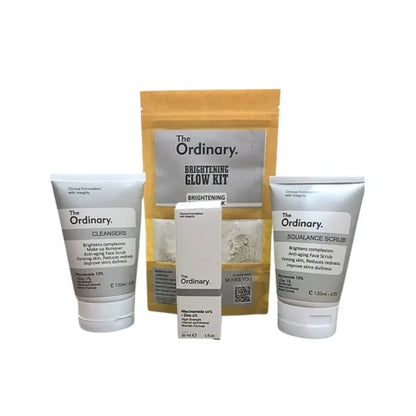 The Ordinary skincare product set including cleanser, scrub, and packaging on a white background