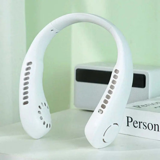 White neckband device on a light surface with a green background
