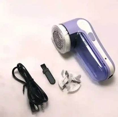Fleece shaver with accessories on a light background