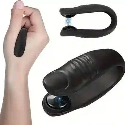 Black handheld device with a lens, held by a hand on a white background
