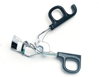 Eyelash curler on a white background