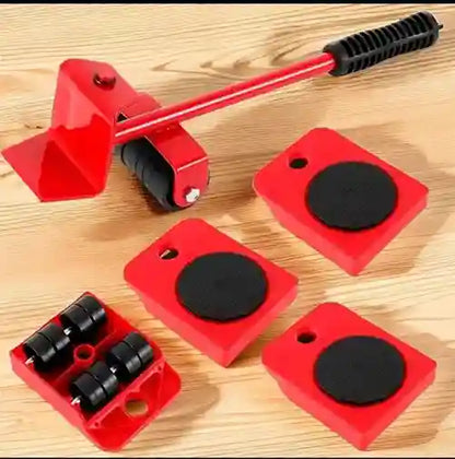 Red tools with black components on a wooden surface