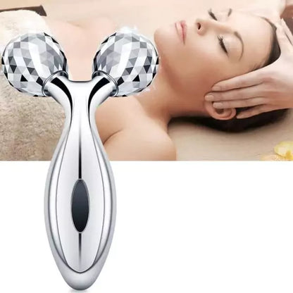 Beauty roller device with a blurred background of a person using it on their face.