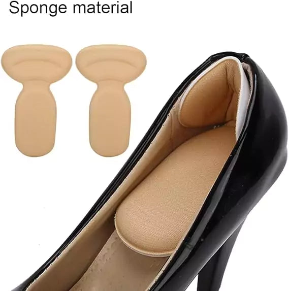 Beige shoe inserts with a black high-heeled shoe on a white background