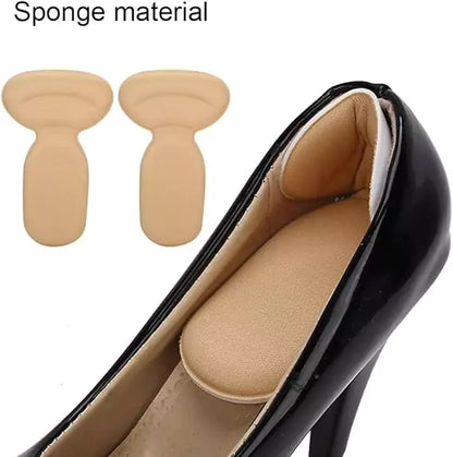 Beige shoe inserts with a black high-heeled shoe on a white background