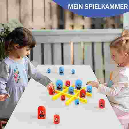 Two children playing with colorful toys at a table outdoors.
