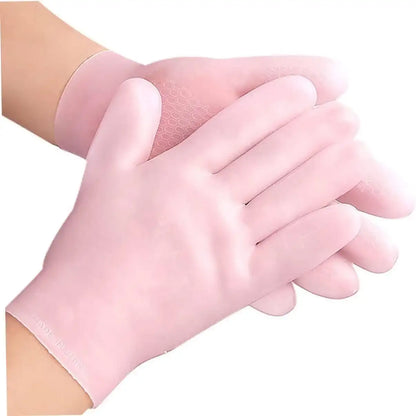 Pink gloves being worn on a white background