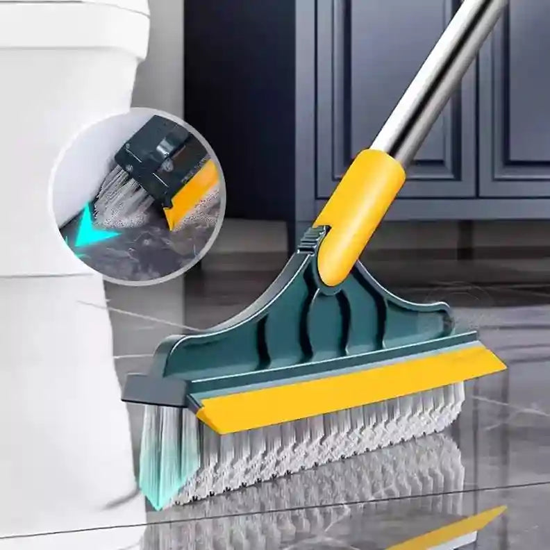 Cleaning tool with brush and squeegee on a tiled floor