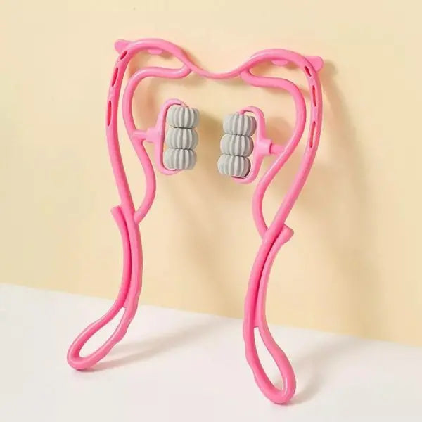 Pink facial roller with gray rollers on a beige background