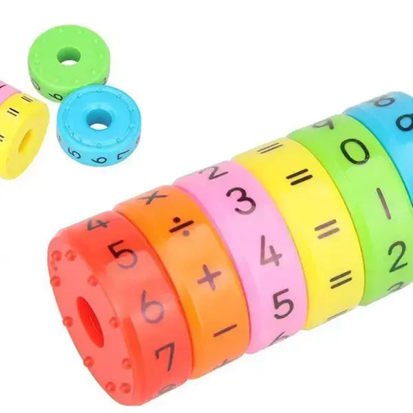 Colorful mathematical symbol and number toy on a white background