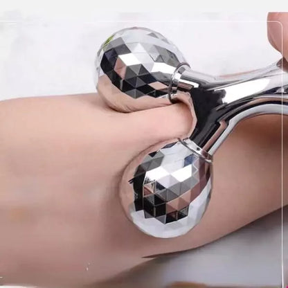 Silver metallic object on a person's arm with a white background