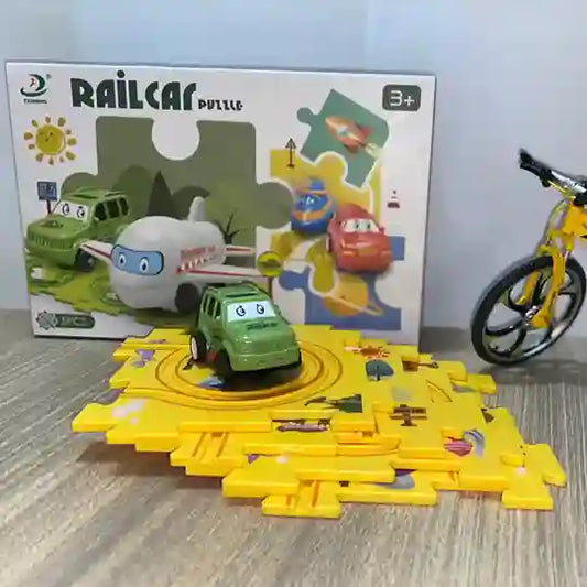 Toy puzzle with railcar design, featuring a green toy car and yellow track, with packaging in the background.