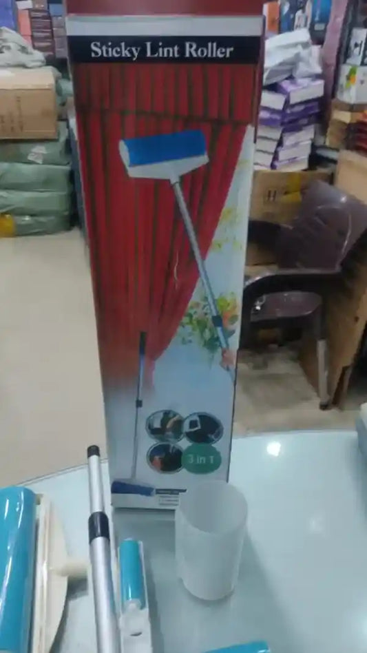 Sticky lint roller with packaging on a table in a store setting