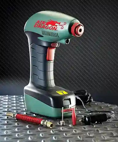 Air dragon cordless drill on a metallic surface with a dark textured background