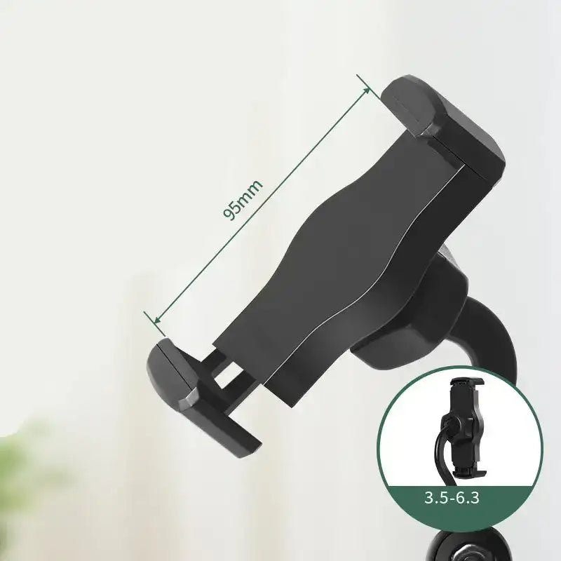 Black phone holder with measurement details on a light background