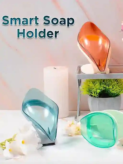 Smart soap holder with colorful design on a white surface with flowers and a candle.