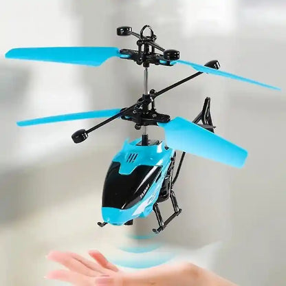 Blue and black toy helicopter with remote control on a white background