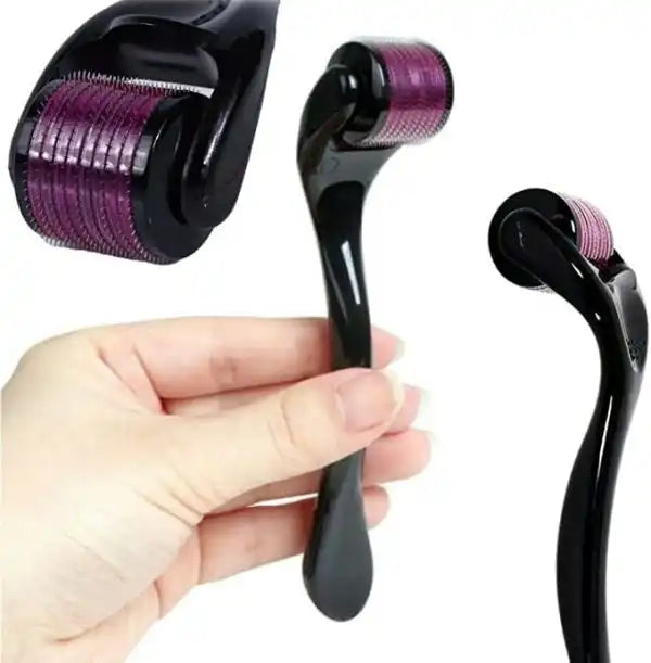 Black derma roller with purple micro Needles held in a hand on a white background