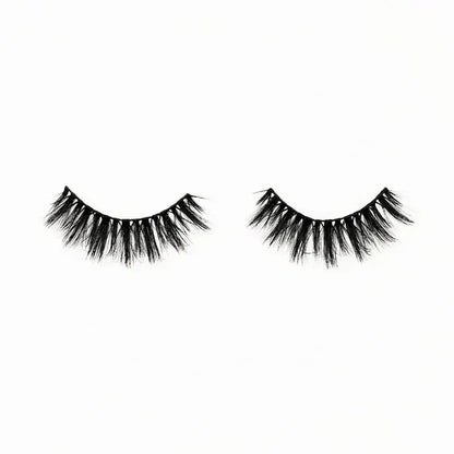 Pair of black false eyelashes on a white background