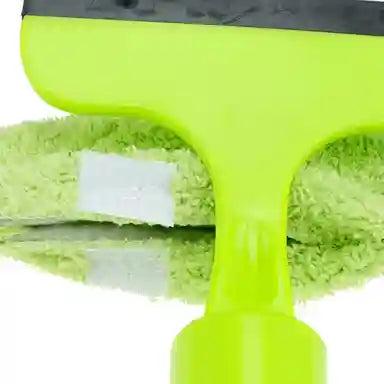 Green squeegee with a white label on a white background