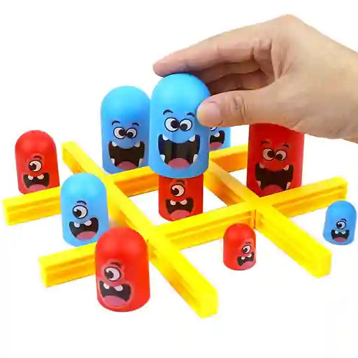 Colorful toy structure with cartoon face pieces and a hand interacting with it on a white background