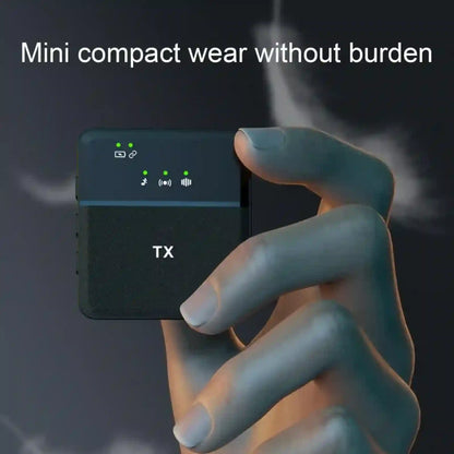 Hand holding a small electronic device with 'TX' on it against a dark background.