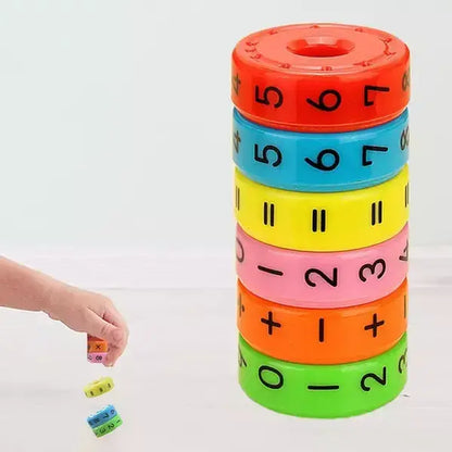 Colorful stack of educational toy rings with numbers and mathematical symbols on a white background.
