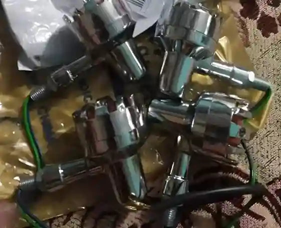 Collection of metal valve components on a textured surface