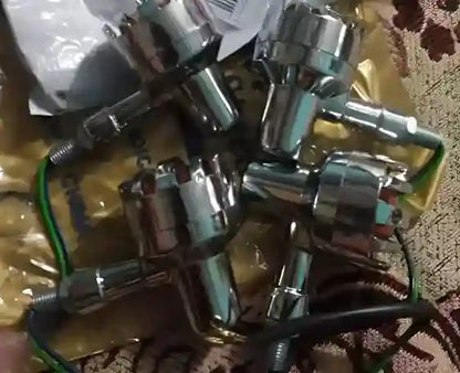 Collection of metal valve components on a textured surface