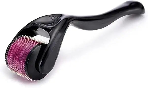 Black derma roller with pink head on a white background