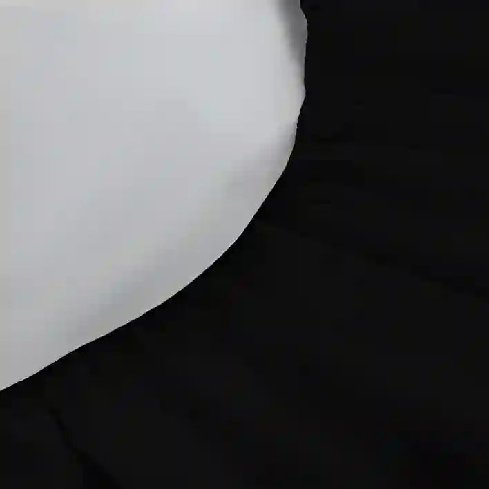Close-up of a white object on a black background