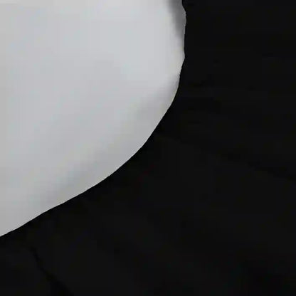 Close-up of a white object on a black background